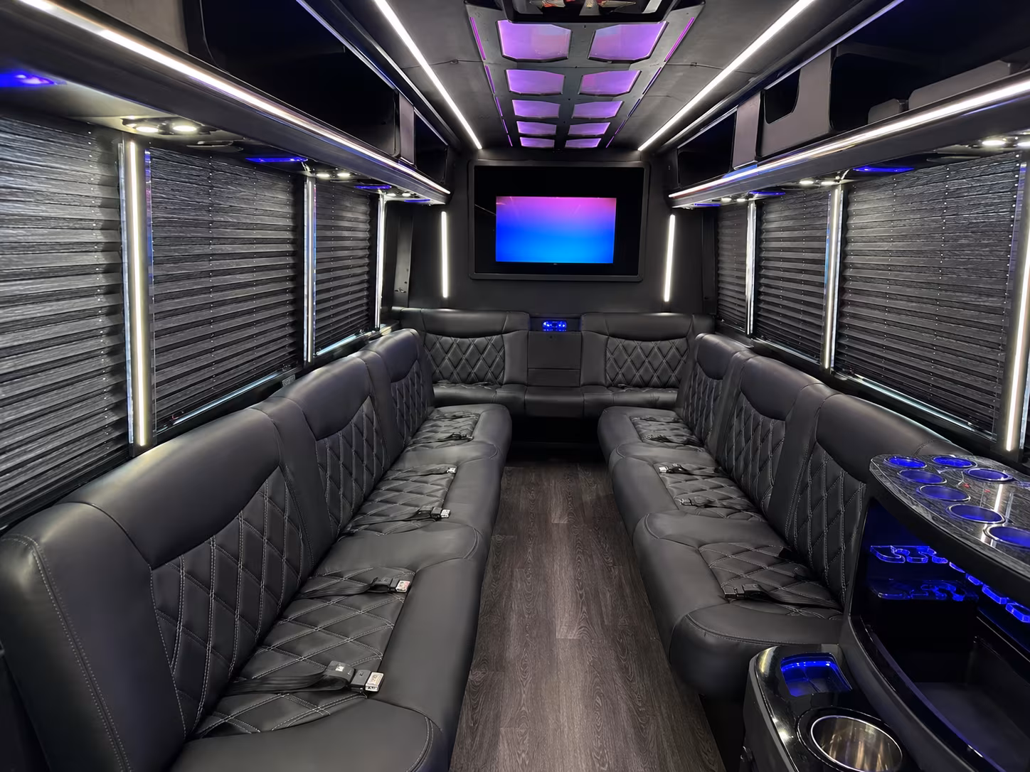 Wedding guests seated inside a party bus serving Edison